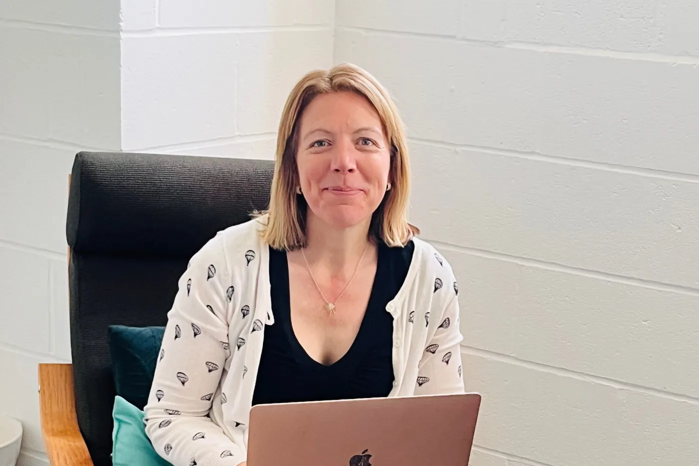 Dr Rebecca Hiscutt PhD, RD, with her laptop, ready for an online appointment