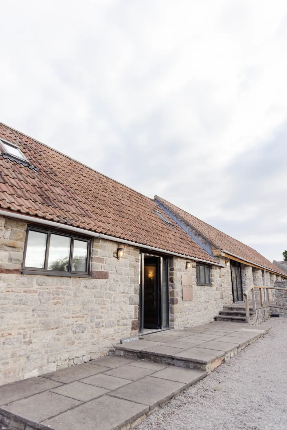 The stone barn at Twelve08, Tickenham, with the entrance on the left